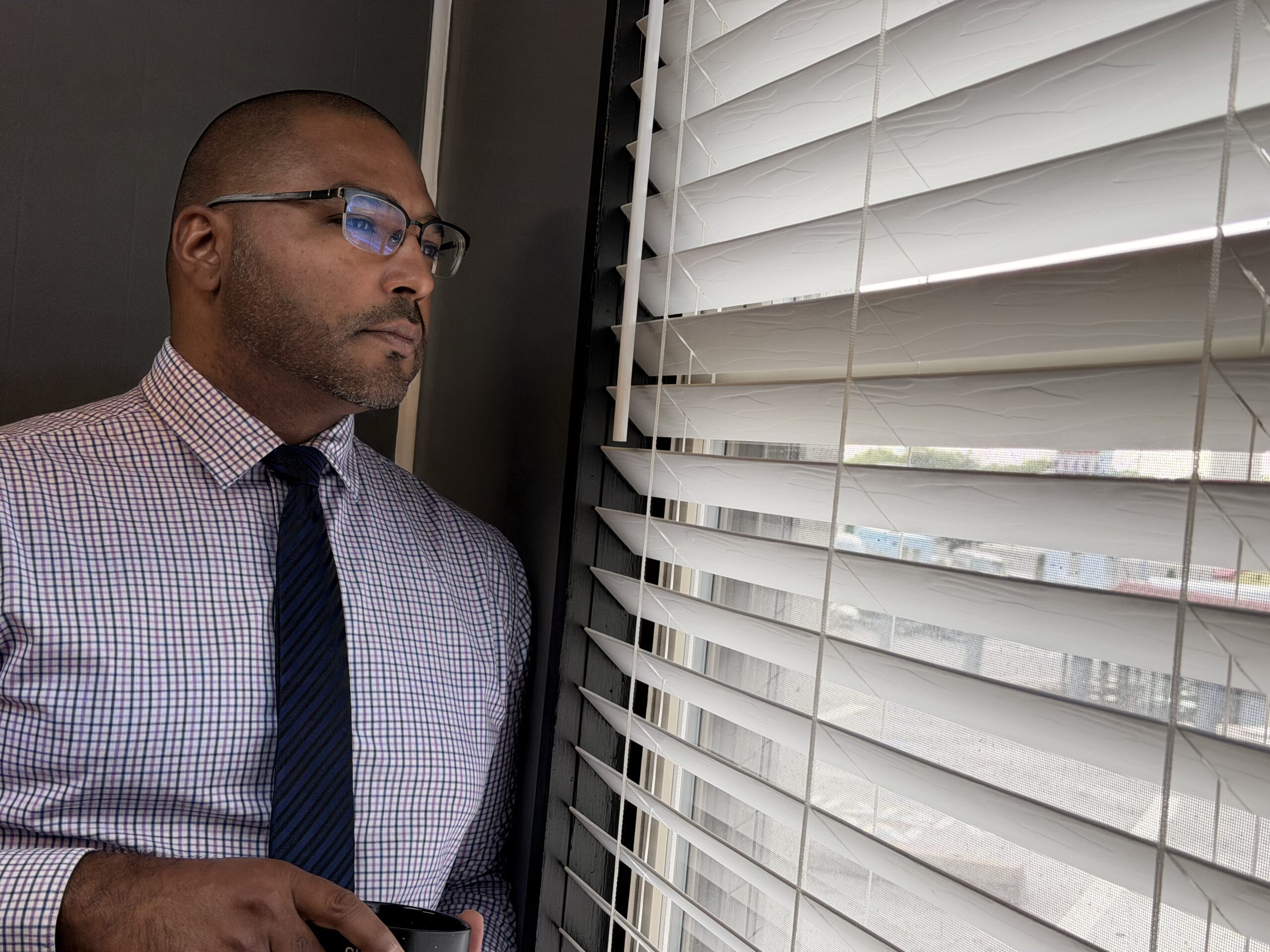 D. Colton Baker, Blount County divorce attorney, by the office window