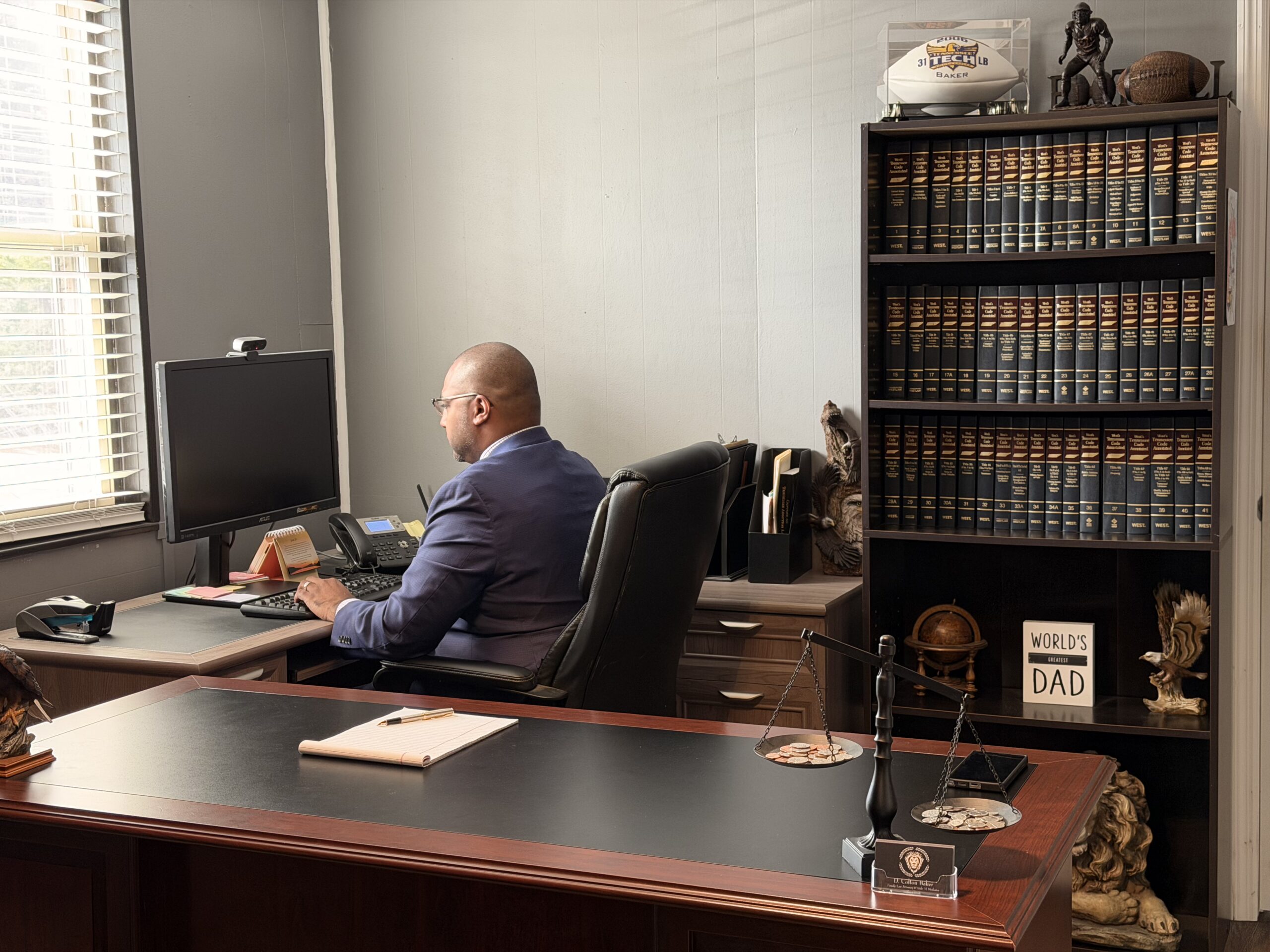 D. Colton Baker, Blount County contested divorce attorney, working at his desk