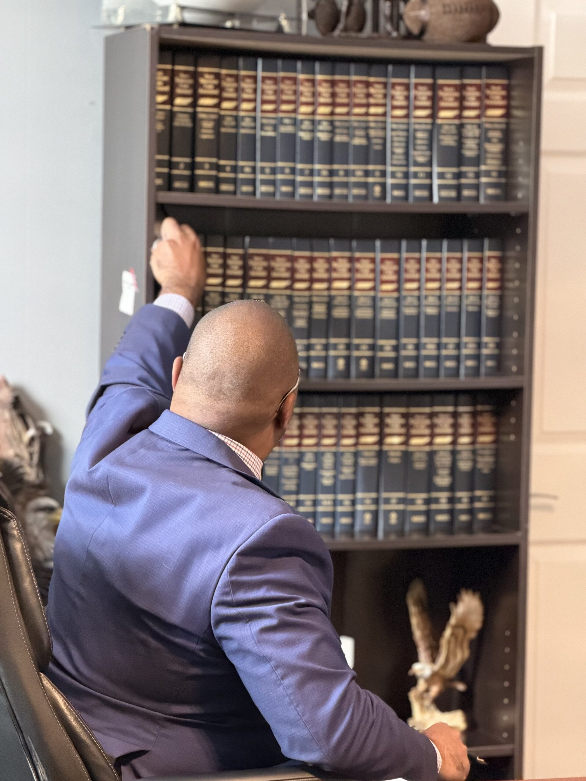 D. Colton Baker, Blount County family law attorney, with his law library