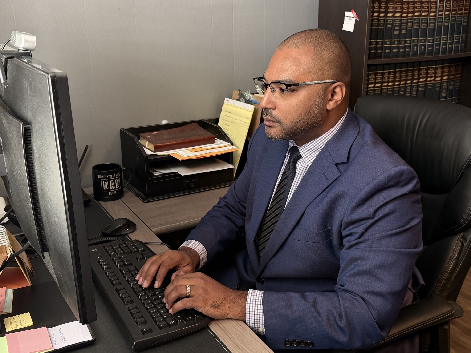 D. Colton Baker, family law attorney, working at his desk in Alcoa, TN